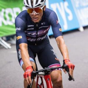 a_man_riding_a_bike_down_a_street__aerodynamic_body__training__grey_suit__background___diego_fazio__in_australia__competition_-9a4cb06b-b14b-4a3c-8a60-bfc645cbaf9b